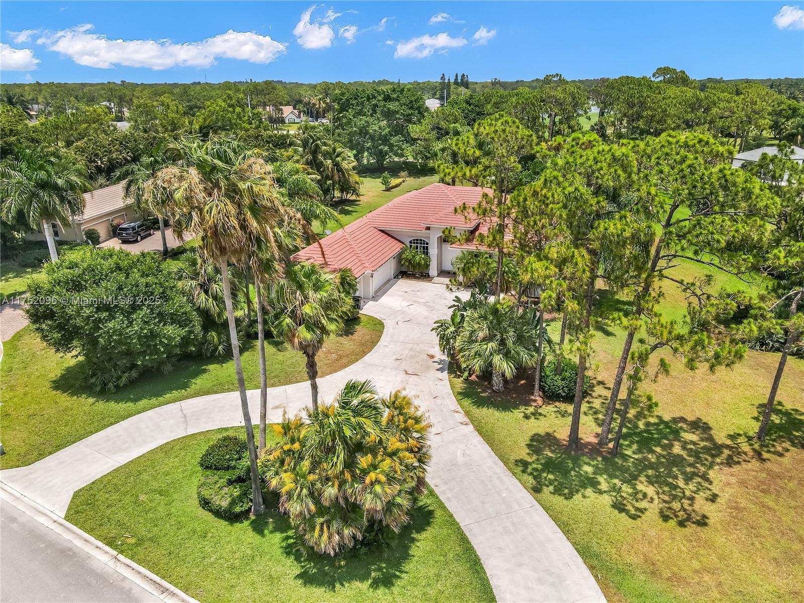 You can live in paradise! Completely furnished, this home sits on an acre with plenty of space in the desirable gated community of Bayhill Estates. Perfect house for families! This house has 4 bedrooms/3 bathrooms, volume ceilings and a great split floor plan. Perfectly located on a quiet cul-de-sac with golf views and a spacious driveway with a 3 car garage. The incredible outdoor area is the perfect private Oasis for entertaining with a beautiful large screened pool /spa. Golf through in-community PGA National is available.