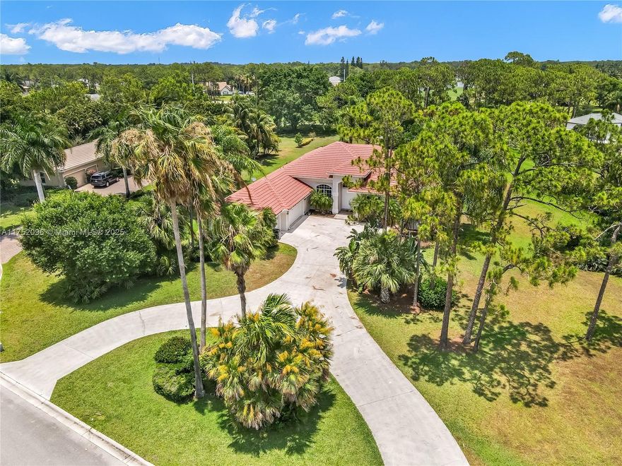 You can live in paradise! Completely furnished, this home sits on an acre with plenty of space in the desirable gated community of Bayhill Estates. Perfect house for families! This house has 4 bedrooms/3 bathrooms, volume ceilings and a great split floor plan. Perfectly located on a quiet cul-de-sac with golf views and a spacious driveway with a 3 car garage. The incredible outdoor area is the perfect private Oasis for entertaining with a beautiful large screened pool /spa. Golf through in-community PGA National is available.