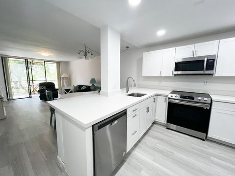 Photo of 7950 W Mcnab Rd #222, Tamarac, FL 33321 (MLS # A11792568)