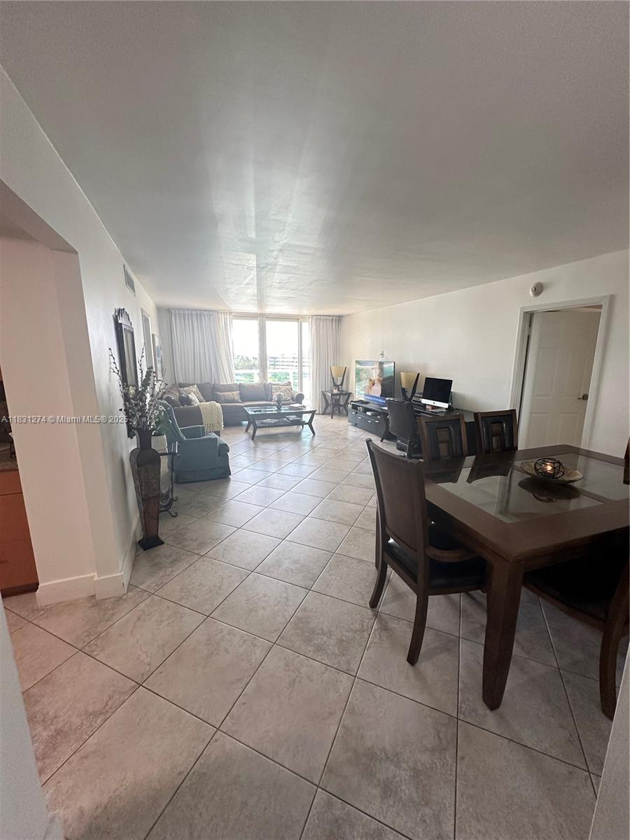 Stunningly renovated condo at Arlen House East, boasting a spacious open balcony and Hurricane Proof Windows, ensuring both comfort and safety. Positioned just steps away from the beach, this unit features 2 bedrooms and 2 bathrooms, with sleek tile flooring throughout. The building offers a wealth of amenities, including a sparkling pool, well-equipped gym, indulgent spa, relaxing sauna, convenient library, valet parking, and round-the-clock security. Enjoy the luxury of immediate rental availability upon closing. Experience beachside living at its finest!