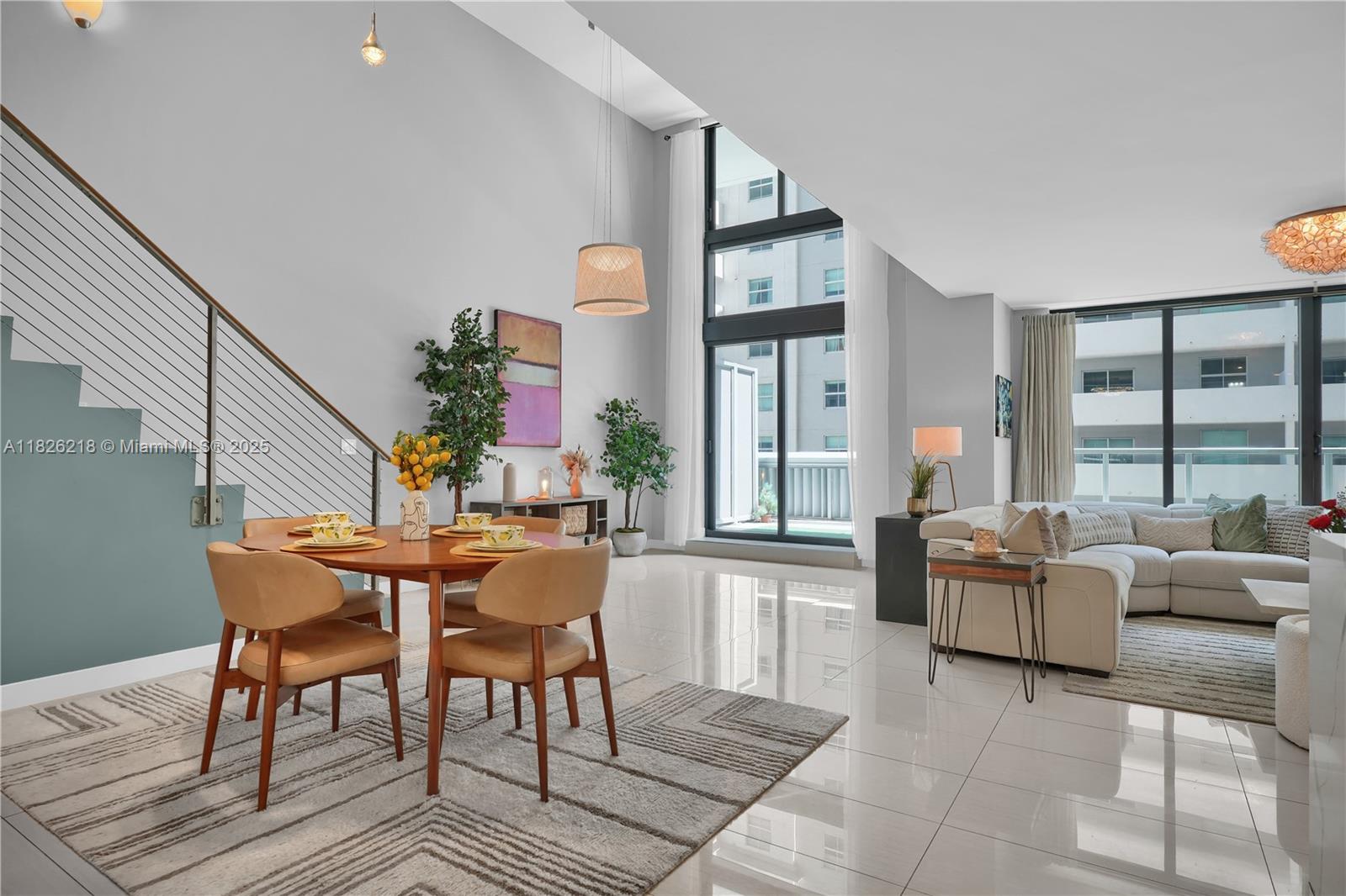 Welcome to a stunning 2-story townhouse offering the space and comfort of a single-family home with the convenience of resort-style condo living and nestled in Miami’s most vibrant neighborhood. Spanning nearly 2,000 sq ft, this unique 3-bed, 3-bath home features soaring 18-ft ceilings and a sleek modern kitchen with new appliances and a quartz waterfall peninsula. The open-concept living area is expansive and the flow extends seamlessly to a generous private terrace. A bedroom and full bathroom is downstairs while upstairs features a primary suite with a spa-style bath and an extensive third bedroom with a full bath. Enjoy 2 parking spots, 3 resort-style pools, steam room, fully equipped gym, kids' playroom, and unbeatable access to transit, Brickell City Center, dining, and nightlife.