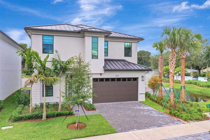 Stunning, never lived-in 4 Bedrooms, 3 full bathrooms plus loft on the 2nd floor and guest bathroom on the ground level, new construction home in a private gated community near Safe Harbor Marina (LMC). This designer upgraded residence features custom built-in closets, modern window treatments, lighting throughout the entire home, large living spaces with formal dining, living room and family room. Enjoy a gourmet kitchen with top of the line appliances, impact windows, highest elevation to protect your home and car from the Florida floods. Spa inspired bathrooms, High ceilings, Custom Closets and top of the line window treatment to enhance the privacy. Two-car garage. Lake views, no west neighbors, and peaceful sunsets complete this rare & unique listing.