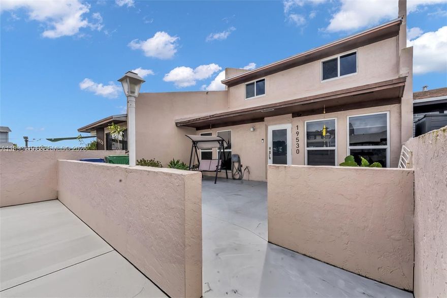 Beautifully renovated 3-bedroom, 2-bathroom townhouse located in the highly desirable Lakes of Acadia community in Miami Gardens. This home features a charming front porch and an enclosed back porch, perfect for relaxing or entertaining. 

 The versatile split floor plan offers three bedrooms and one bathroom upstairs, plus a ADDITIONAL separate one-bedroom, one-bathroom layout downstairs, ideal for multi-generational living or guests.

 Residents enjoy access to community amenities including a swimming pool, tennis court, clubhouse, children’s play area, and well-maintained green spaces.

 Conveniently located near major highways, shopping, and dining, with easy access to all parts of Miami. Nearby public, charter, and magnet school options provide flexibility for a variety of educational needs. 

 Some photos in this listing have been virtually staged to illustrate the home's potential. Measurements and actual room configurations may vary.