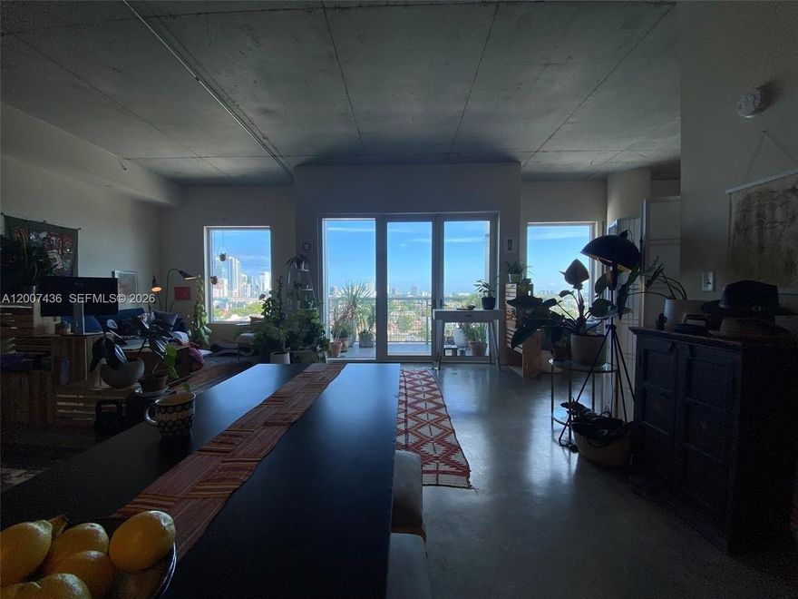 Live the ultimate Miami loft lifestyle in this expansive 2BR/2BA residence at Neo Lofts ideally positioned along the Miami River with sweeping city and water views. This light filled industrial style loft features soaring ceilings polished concrete floors and oversized windows that flood the space with natural light creating a bright and airy urban feel. The spacious living and dining areas open to a covered balcony offering 180° views of the Brickell skyline south toward Coconut Grove and west across the city ideal for sunset watching and skyline views. The kitchen offers an open dining eat in bar stool island ideal for casual dining and entertaining. While recorded as a 2/2 the residence is currently configured as a large open loft providing a flexible blank canvas for a buyer to customize enclose bedrooms or create a personalized layout. This rarely available 09 line features a true square floor plan that is easier to furnish than the irregular layouts typical of Neo Lofts. Optimal mid tower location with only very few neighboring units offers added privacy. Aggressively priced with recent mirror image sale supporting value. Well maintained full service investor friendly building with low resale inventory reflecting strong owner hold. Maintenance fees are notably lower than comparable Brickell towers just minutes away. Prime location between Little Havana Brickell and Downtown with long term upside as Miami Dade continues to see in migration from major coastal markets.