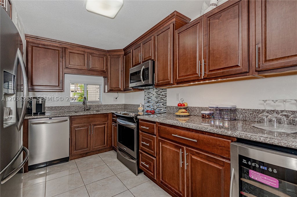 Photo of 9410 N Hollybrook Lake Dr #11-109, Pembroke Pines, FL 33025 (MLS # A12036259)