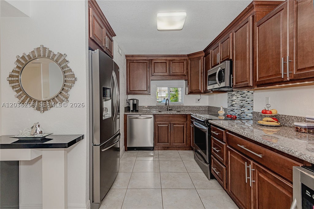 Photo of 9410 N Hollybrook Lake Dr #11-109, Pembroke Pines, FL 33025 (MLS # A12036259)