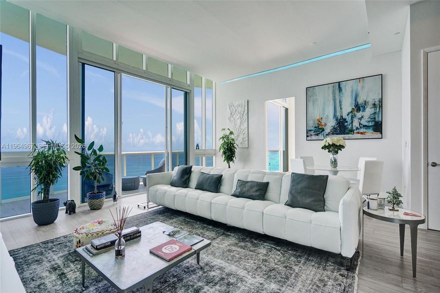 Penthouse living at its finest. This exquisitely furnished 3BR/3.5BA corner residence rises from the 43rd floor of Trump Tower II, delivering unobstructed ocean, city, and Intracoastal views from sunrise through sunset. Newly painted and thoughtfully styled with curated, modern design touches, the home is offered fully furnished with Natuzzi pieces throughout—a designer furniture package valued at approximately $80,000. The residence has also benefited from significant investment in upgrades—approximately $100,000+, including motorized shades and blackout treatments, professional painting, and a custom laundry room build-out for enhanced functionality and storage. These are just a few of the enhancements completed, along with additional improvements that further elevate the home’s comfort, presentation, and ease of living. Clean, minimalist A/C vent upgrades complement the refined aesthetic, while the gourmet kitchen and expansive primary suite elevate daily living. A wraparound balcony with direct ocean exposure creates a true indoor-outdoor penthouse experience. Enjoy Trump Tower II’s 5-star lifestyle with on-site restaurant, beach service, spa, fitness center, pool, concierge, and valet, all in a prime Sunny Isles Beach location just minutes to Bal Harbour Shops and Aventura Mall. Furniture included.