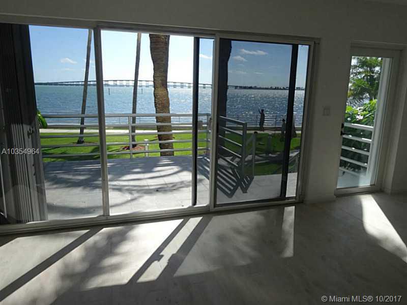 Waterfront unique Brickell townhouse, recently remodeled 2BR / 2.5BA. Urban living with island flare due to spectacular bay view. Full service building, gym, tennis, kids play room, 2 assigned parking spaces plus valet. Washer/dryer inside unit. Walking distance to shops, restaurant, financial district & metro mover. Building offers concierge & valet.