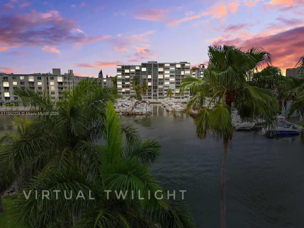 Welcome home. Conveniently located condo has just become available, Tiled through out, crown moldings, newer kitchen and baths. Stunning view of the marina, boat traffic, Stadium. Located near mall, expressways and houses of worship. Do not delay and call us today for a viewing. Association has reserves and owner occupant buyers can purchase with 3% down. Don't delay and call us today! Thank you and remember to make it a Great, Sunny, South Florida Day! It's a Good Life!