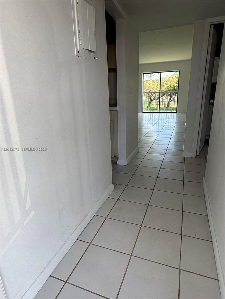Spacious 2-bedroom, 2-bath condo in Rozland Condo offering 768 SF of living area in a convenient West Kendall location. This second-floor residence features tile flooring throughout, an open living/dining area, pass-through kitchen, and peaceful garden/water views overlooking a small lake/pond area. The unit is vacant and offers excellent potential for an owner-occupant or investor looking to update and add value. Conveniently located near shopping, restaurants, schools, parks, Baptist West, Miami Dade College, Walmart, and major roadways. Association information, rental restrictions, pet restrictions, parking, and fees to be verified by buyer/buyer’s agent.
