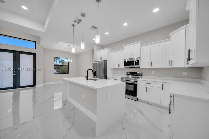 THIS HOME IS TRULY A MUST SEE! Welcome to this stunning BRAND-NEW CONSTRUCTION home nestled in a quiet, friendly neighborhood in Lehigh Acres—where modern design meets everyday comfort. Offering 1,568 SQFT of thoughtfully planned living space, this home features 3 BEDROOMS plus a versatile DEN and 2.5 BATHROOMS, perfect for today’s lifestyle. The OPEN-CONCEPT KITCHEN is the heart of the home, showcasing GRANITE COUNTERTOPS, STAINLESS STEEL APPLIANCES, a spacious PANTRY, and an ideal layout for entertaining or casual family meals. Granite countertops continue throughout the bathrooms and laundry room, creating a clean, cohesive, upscale feel. The LAUNDRY ROOM INCLUDES CABINETRY AND A WASHER & DRYER, making move-in effortless. The primary suite offers DUAL CLOSETS, while the DEN/OFFICE FEATURES ITS OWN HALF BATHROOM WITH DIRECT ACCESS TO THE EXTENDED LANAI—ideal for a home office, guest suite, or private retreat. With quality finishes, smart design, the PEACE OF MIND of new construction, and THE ADDED BENEFIT OF NOT BEING IN A FLOOD ZONE, this home is 100% MOVE-IN READY AND BUILT TO IMPRESS. SCHEDULE YOUR PRIVATE SHOWING TODAY BEFORE IT’S GONE!