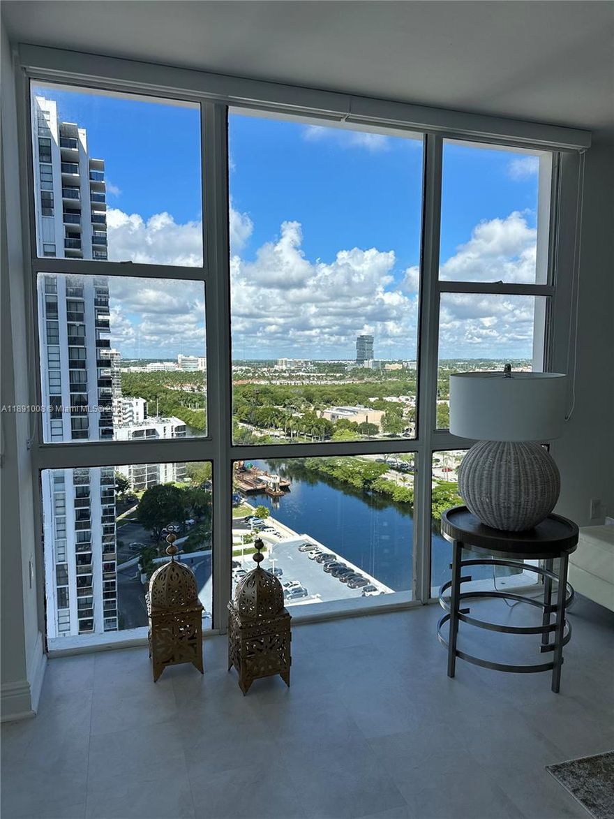Turn-key and in pristine condition! This beautifully furnished 2-bedroom, 2-bathroom corner unit in the heart of Aventura offers breathtaking views of the Intracoastal and city skyline. The residence features an open, bright layout with floor-to-ceiling windows that flood the space with natural light.Enjoy tasteful designer furnishings, a fully equipped kitchen, spacious living and dining areas, and two comfortable bedrooms — all decorated with a modern, coastal touch. The private balcony is perfect for relaxing and taking in the stunning sunsets. Cable and internet included. Laundry facility on every floor. Located in a well-maintained building with resort-style amenities, including a pool, gym, 24-hour security, and easy access to Aventura Mall, beaches, and golf courses.