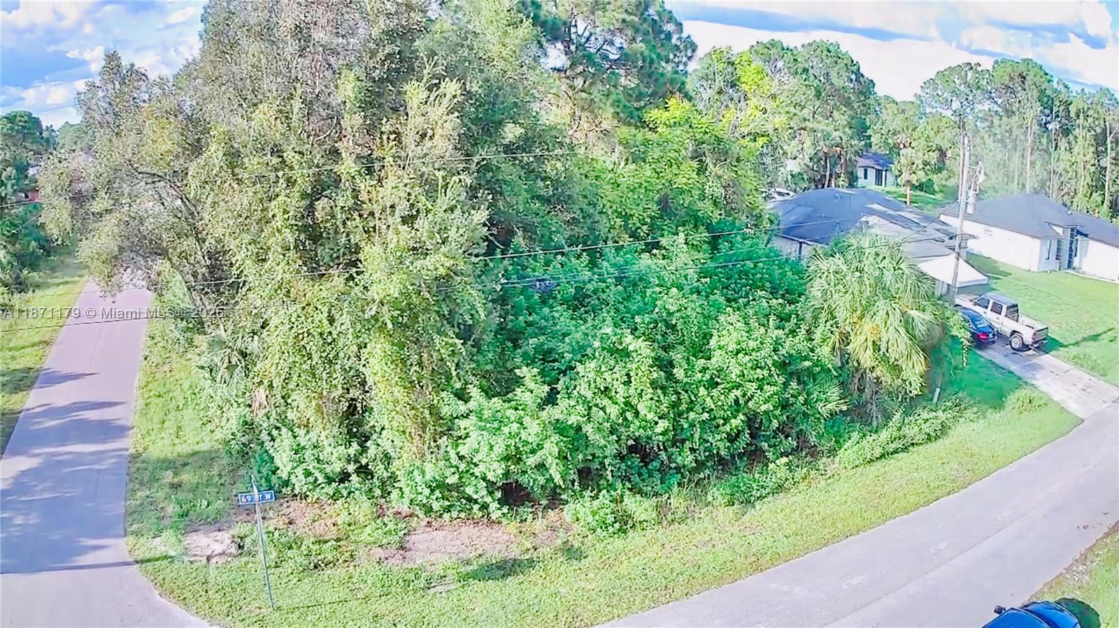 Corner lot ready for new owner. New large homes being built all around this property. Paved road. Power lines on site. Quiet desirable neighborhood.