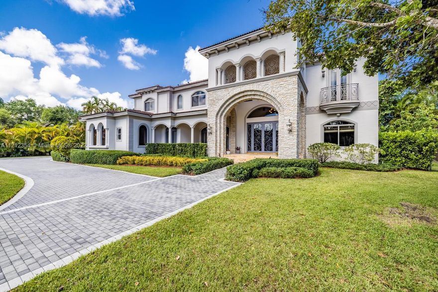 Old world meets modern in this Chateau-inspired estate, built in 2008, featuring panoramic lake views throughout. Lapping water beckons ..... sit and enjoy tranquility and serenity at the edge of Rock Lake in Pinecrest.  Flowing staircase, double height ceilings, infinity pool, terrace with summer kitchen, 3 car garage, butler's pantry, wine cellar, Viking appliances (gas stove), elevator shaft. Dreamy master bedroom offers foyer and parlor with wrap around windows for majestic lake views. Every room with bathroom en-suite. Rich stonework and textures throughout, travertine marble floors.  Built in firepit. AC's replaced in 2019, A-rated Pinecrest schools nearby. Two bedrooms and full baths downstairs. Immerse yourself in the grandeur and luxury of this home. You'll never want to leave!