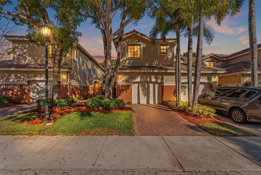 Beautifully updated 4-bedroom, 2.5-bath “Elite” floor plan offering 1,790 sq ft in highly desirable Weston with A+ rated schools. This corner unit features a rare private courtyard and peaceful garden views, creating the perfect setting for outdoor living and entertaining. The interior showcases a fully remodeled custom kitchen with extended maple cabinetry, oversized pantry storage, quartz countertops, Custom bar with LED lighting, premium appliances including quiet MIELE dishwasher, luxury vinyl flooring on the first floor, crown molding, and updated bathrooms. Major upgrades provide true peace of mind, including 2019 water heater, 2025 fresh interior paint, smart home Google Nest integration for the front door and A/C, UV air purification, updated plumbing and water line, newer refrigerator, Hunter fans, custom blinds, and more. 1-car garage with added shelving for extra storage. Move-in ready with modern finishes, functional layout, and low-maintenance living in one of Weston’s most sought-after communities with upcoming HOA improvements already funded. A rare opportunity combining privacy, views, and upgrades in an unbeatable location.