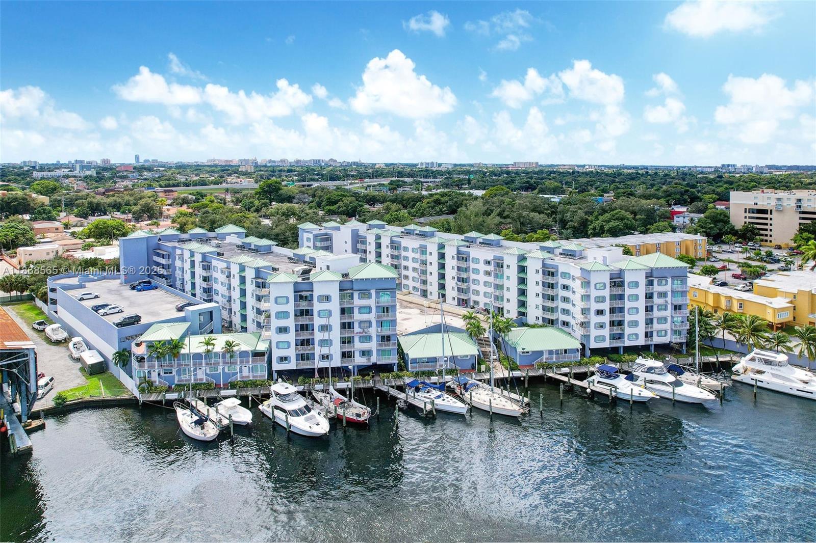 Beautiful 2 bed/2 bath condo on the Miami River in a gated community with 24/7 security. Features include 2 assigned covered parking spaces, in-unit washer/dryer, porcelain tile floors throughout, and impact windows with sliding glass doors. Spacious layout with generously sized bedrooms; the primary suite offers a large closet. Relax on the marina boardwalk, enjoy evening walks, or simply sit and take in the views. Convenient, secure, and perfectly located—don’t miss this opportunity!