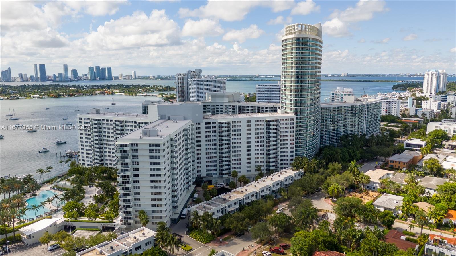 Stunning corner penthouse offers 2,029 square feet of elegantly designed space with panoramic bay, ocean and SoBe views (West, East + South). Welcome every sunrise and sunset from the two private balconies. Live in the center AND top of South Beach on 16.5 waterfront acres in the heart of the city. The star of the condo is the 40 ft long Great Room with floor to ceiling hurricane-impact windows. Outdoor enthusiasts will appreciate the bay-front pools, barbecue area, common garden, and patio spaces, perfect for entertaining or unwinding. Big indoor playroom adds to the family appeal. Pet spa on-site also offers convenient doggie care and dog-sitting. 2 garage spaces , health club, no assessments and secure finances . Price is firm and seeking strong offers at list price!