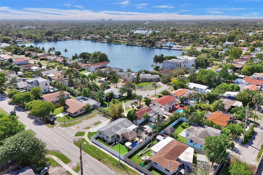 Renovated, stylish & family-friendly home in a prime Miami area. This corner property boasts a welcoming facade, fenced yard, and stone-paved walkway. Inside, enjoy an open floor plan with sleek, minimalist design, natural light, and a stone-accented living room wall. The modern kitchen offers white countertops, stainless steel appliances, and ample storage. Luxurious bathroom includes a freestanding tub and gold-accented double vanity. The home includes a private theater, luxurious bathroom, and resort-style backyard with a pool, gazebo, and play area. Nestled in a peaceful neighborhood near top schools, parks, and dining, this home offers both comfort and convenience.