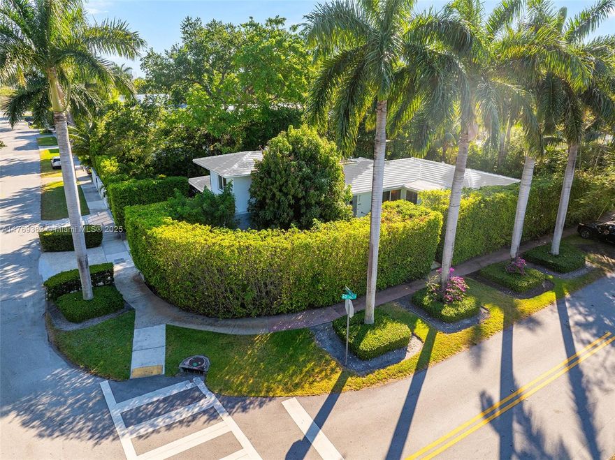 A one-of-a-kind opportunity to own a rare corner-lot residence on prestigious Upper North Bay Road, masterfully designed by renowned architect Norman Giller. This fully renovated Mid-Century Modern gem is privately tucked behind lush hedges with a gated entry and tropical landscaping. Features include 4 bedrooms, 4 baths, and a private office/library with en-suite bath. Elegant limestone and walnut hardwood floors, chef’s kitchen with Miele appliances, Sub-Zero fridge, and custom walnut cabinetry. Impact windows and doors, 1-car garage with A/C, and a secluded heated pool complete this private oasis. A truly unique offering.