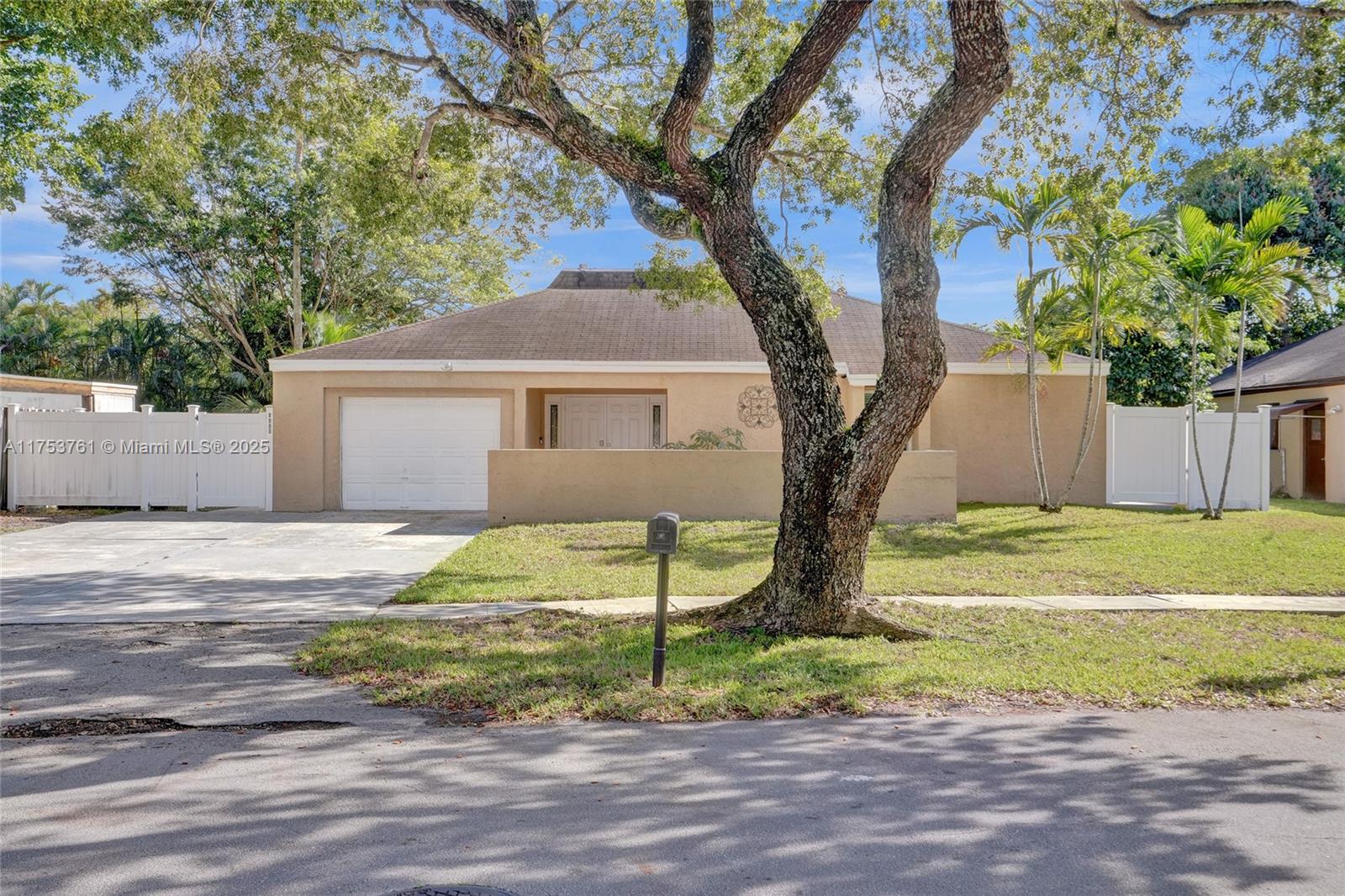 Welcome! Beautifully updated 4-bedroom, 2.5-bathroom home in a desirable neighborhood with no HOA. You’ll love the large front porch, perfect for sipping your morning coffee, greeting neighbors or unwinding. Inside, enjoy soaring high ceilings and an open floor plan with large white tile flooring throughout, creating a bright and modern feel. The updated kitchen features plenty of cabinetry and space for entertaining. Hurricane-impact windows and front door for peace of mind. Garage has been converted into living space, offering flexibility for a playroom or home office, can easily be converted back into a garage. Step outside to your private backyard oasis, where you can enjoy outdoor living along a scenic canal—perfect for fishing, boating, or simply taking in the breathtaking sunsets.