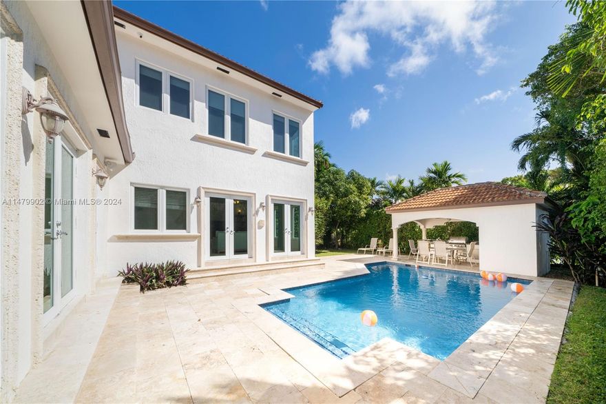 Welcome to this private oasis on coveted North Bay Road. Offering a fantastic floor-plan w/ 3 bedrooms upstairs & 2 downstairs, totaling 5BD/5BA + den/office. Enjoy sun drenched interiors, an open eat-in kitchen w/ cooking island, Great room w/ working fireplace, high ceilings, gleaming wood & marble floors, impact windows & doors, & primary suite w/ 10'6" ceilings, office + nursery, & bath w/ separate jacuzzi tub & shower. Outside find a serene backyard surrounded by lush landscaping & mango/banana trees w/ a gorgeous heated pool, covered summer kitchen w/ Alfresco dining. For added convenience the home is complete w/ a circular driveway w/ ample parking, cameras, & a separate laundry room w/ full sized washer/dryer. Walk to Sunset Harbour!