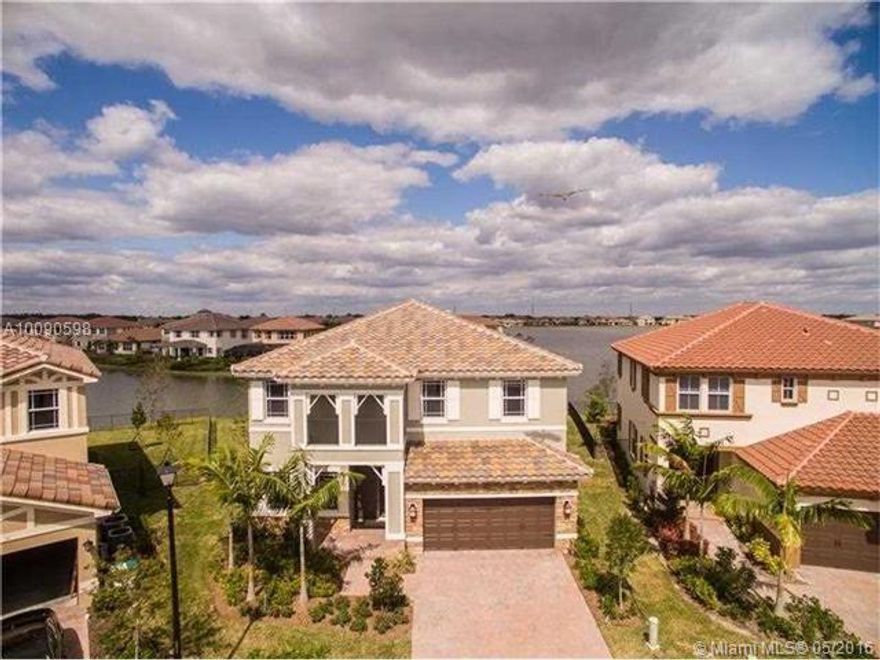 Seller Will Give $5.000 Bonus to Buyer Agent if its a FULL PRICE OFFER! Parkland's newest community Mira Lago. Brand new house (2015) priced below value.WATERFRONT HOME WITH BEAUTIFUL LAKE VIEW. LARGER LOT. HURRICANE IMPACT WINDOWS.HIGH CEILINGS IN LIVING ROOM AND DINING ROOM HIGH ENERGY AC, TANK LESS GAS WATER HEATER, GAS COOK TOP & DRYER. DOUBLE WALL OVENS. Stainless steel appliances, wood cabinets & huge island. Staircase balcony overlooks living room. AMAZING CLUBHOUSE WILL BE READY SOON!! A+ SCHOOLS!