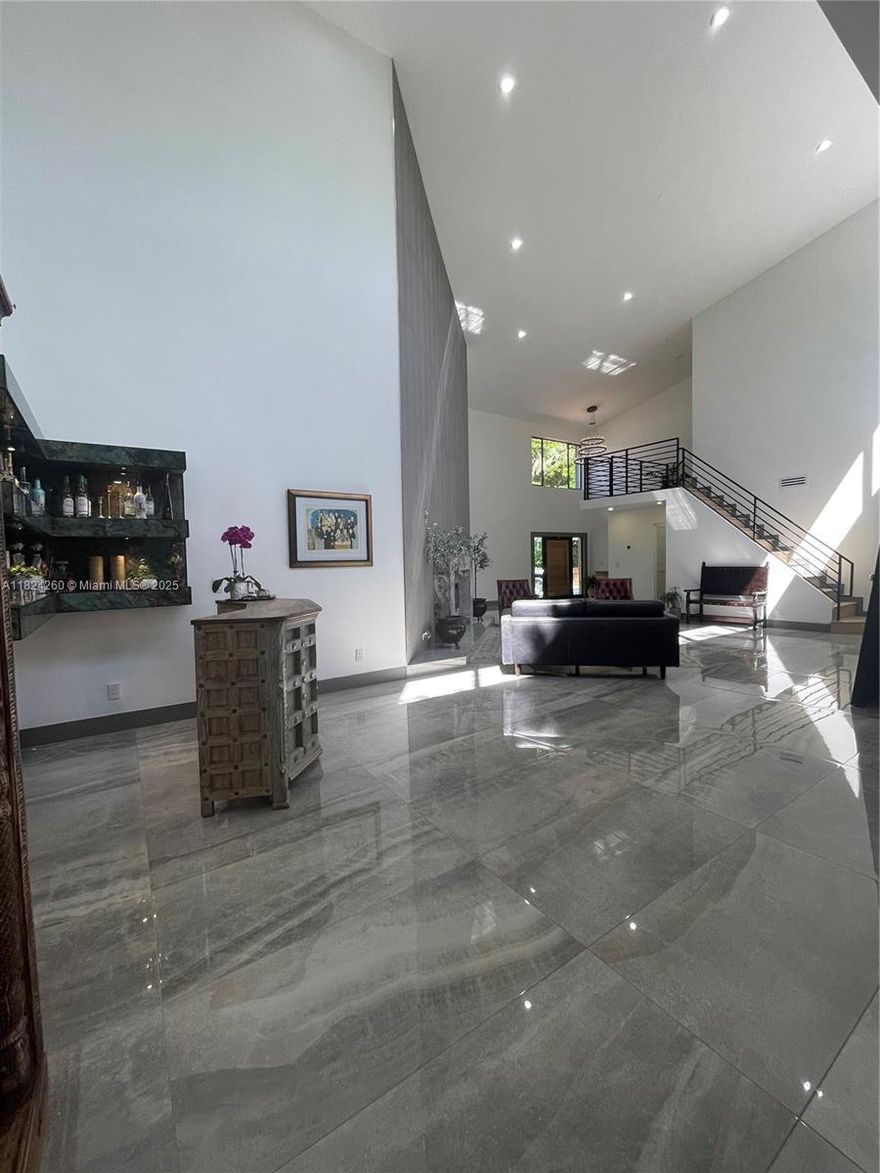WELCOME TO THIS EXCEPTIONAL HOME LOCATED IN THE PRESTIGIOUS GAURD-GATED COMMUNITY OF ARAPAHOE FARMS,  IN EMERALD HILLS !!! SET ON OVER 1/2 ACER OF LUSH, PRIVATE GROUNDS BACKING A TRANQUIL POND AND SPARKLING POOL, THIS FULLY RENOVATED HOME IS A TRUE MASTERPIECE, UNMATCHED IN STYLE, SPACE, & QUALITY. BOASTING OVER 4600 SQ. FEET OF LIVING SPACE, THIS GRAND RESIDENCE FEATURES 7 BEDROOMS & 5 LUXURIOUS BATHROOMS, IMPORTED PORCELAIN FLOORING, CHEF'S KITCHEN, IS A SHOWSTOPPER-COMPLETE WITH TOP OF THE LINE APPLIANCES, INCLUDING ILVE GAS RANGE. NEW ROOF, NEW WOOD DECK, 3 NEW HVAC'S, NEW EVERYTHING !!! SOARING CATHEDRAL CEILINGS, ELEGANT FINISHES, WITH AN EXPANSIVE OPEN-CONCEPT.VERY CLOSE PROXIMITY TO MANY HOUSE'S OF WORSHIP, HARD ROCK CASINO, DOWNTOWN HOLLYWOOD, AND THE BEACHES.