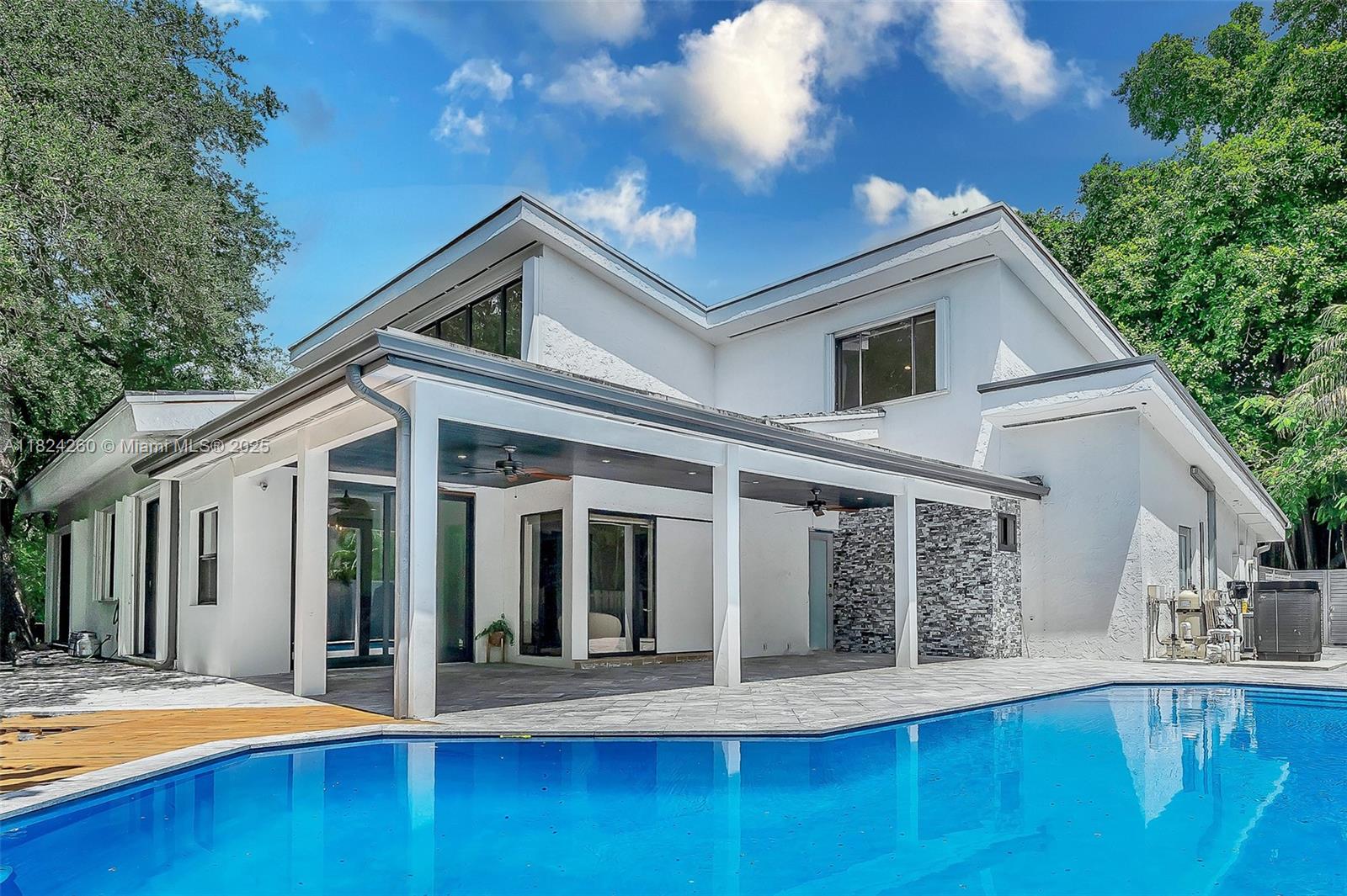EXCEPTIONAL HIDDEN GEM, SITUATED IN ONE OF THE MOST DESIRABLE GAURD-GATED COMMUNITIES IN THE HOLLYWOOD, EMERALD HILLS AREA,BOASTING OVER 4750 SQ.FT OF TRUE LIVING AREA!!! ON OVER A 1/2 ACER OF LUSH, PRIVATE GROUNDS, SET BACK ON YOUR PRIVATE FRESH WATER LAGOON & SPARKLING MODERN POOL.HOME HAS BEEN FULLY RENOVATED AND A TRUE MASTERPIECE, UNMATCHED IN STYLE, SPACE, & ELEGANCE.SOARING CATHEDRAL CEILINGS,ELEGANT FINISHES,WITH AN EXPANSIVE WIDE OPEN-CONCEPT. THIS GRAND RESIDENCE FEATURES 7 BEDROOMS,5 LUXURIOUS BATHROOMS, IMPORTED PORCELAIN FLOORING.KOSHER CHEF'S KITCHEN,COMPLETE WITH TOP OF THE LINE APPLIANCES, INCLUDING ILVE GAS RANGE. NEW ROOF, NEW WOOD DECK, 3 NEW HVAC'S, .VERY CLOSE PROXIMITY TO MANY HOUSE'S OF WORSHIP, AIRPORT, SEAPORT, HARD ROCK CASINO, DOWNTOWN HOLLYWOOD,AND THE BEACHES.