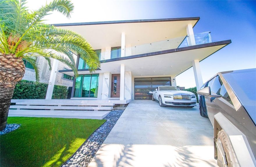 Discover unparalleled waterfront luxury in this 2022 modern masterpiece showcasing mesmerizing Biscayne Bay and Miami skyline views. The residence features soaring double-height ceilings, expansive glass walls, a chef’s gourmet kitchen, and a serene bayfront primary suite. Enjoy six ensuite guest rooms, resort-style pool, summer kitchen, rooftop terrace, and 60-ft dock. Located in North Bay Village