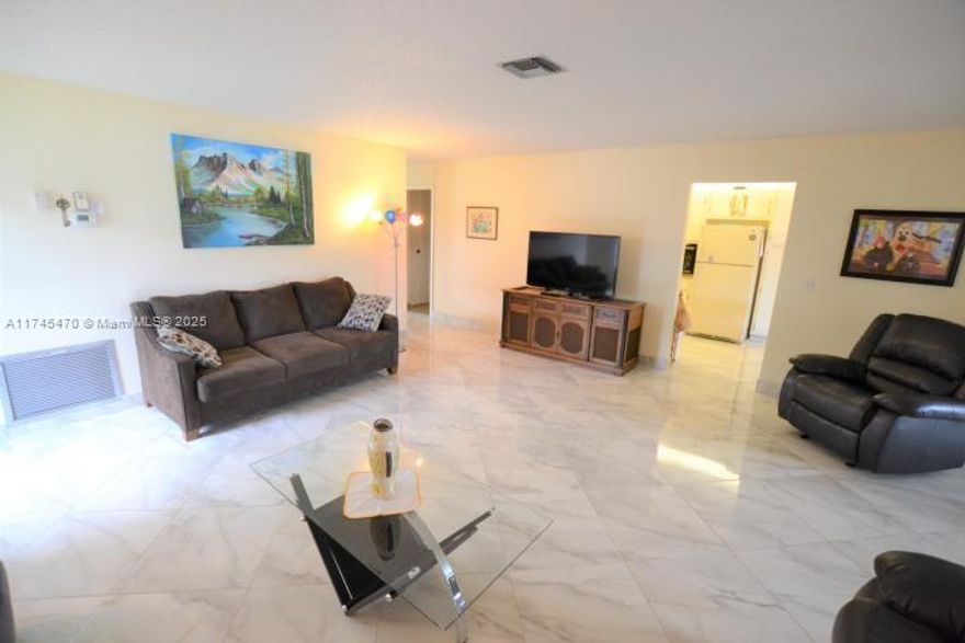 This spectacular corner 2/2 residence feels and lives like it s a single family home. Beautiful diagonal tile flooring throughout the home. Full size washer and dryer in the utility/storage room. Priced to sell.