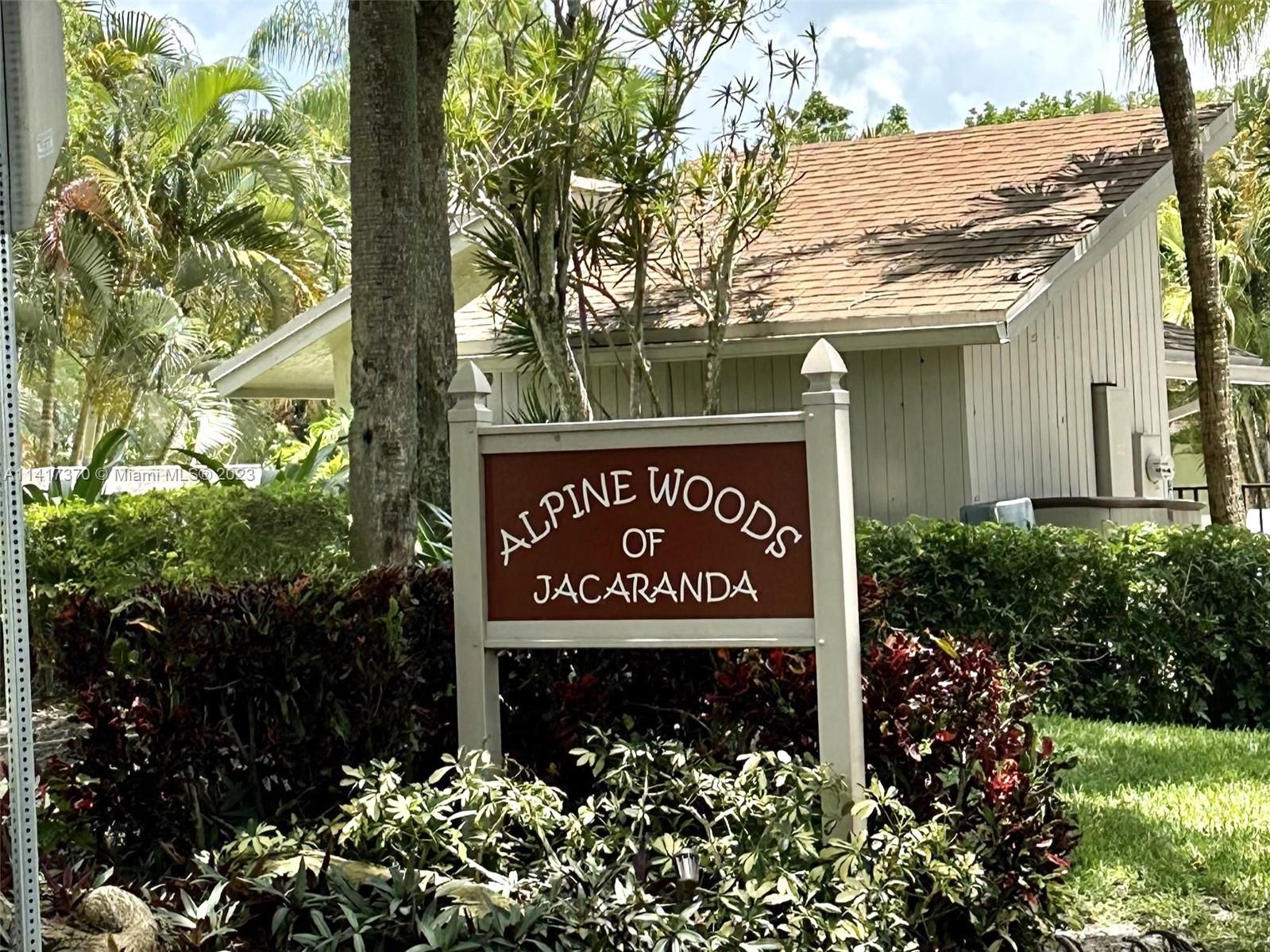 RARELY AVAILABLE!! A Spacious corner villa in highly sought after Alpine Woods of Jacaranda! Lots of potential in this 2BR 2BTH villa with vaulted ceilings, large living and dining room area, enclosed screen patio, accordion hurricane shutters, and 2 parking spaces. community offers a large, heated swimming pool, plenty of guest parking, and accepts big dogs. There's also a public tot park a few steps away! right in the heart of Plantation close to many restaurants, shopping, major highways, and more!! WONT LAST!!!