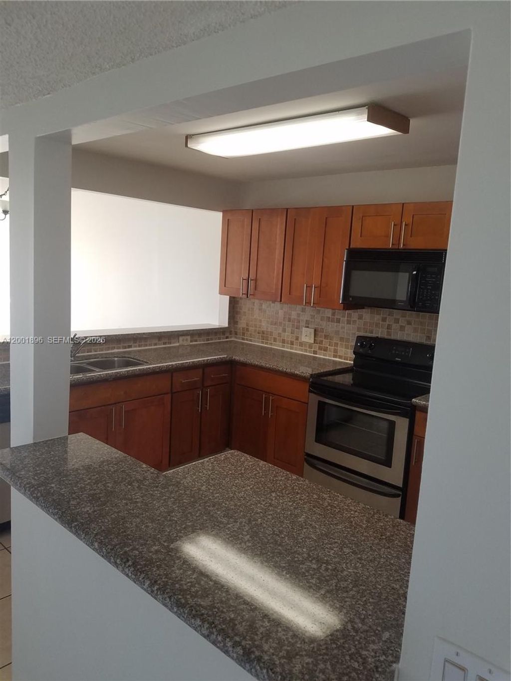 Photo of 310 Racquet Club Rd #204, Weston, FL 33326 (MLS # A12001896)