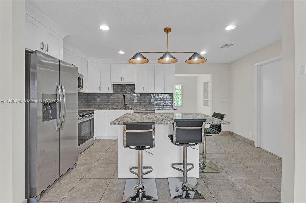 Photo of 804 SW 24th St, Boynton Beach, FL 33426 (MLS # A11660948)