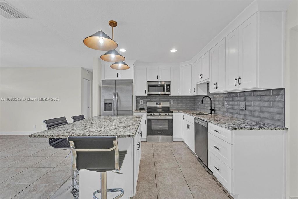 Photo of 804 SW 24th St, Boynton Beach, FL 33426 (MLS # A11660948)