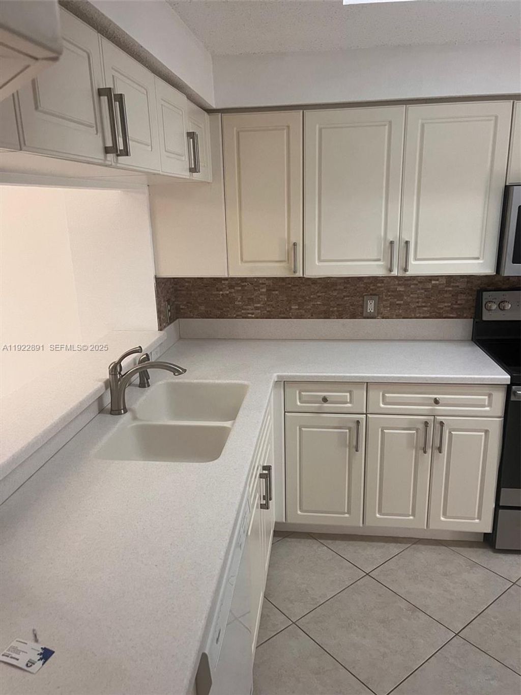 Photo of 3021 Alcazar Pl #203, Palm Beach Gardens, FL 33410 (MLS # A11922891)