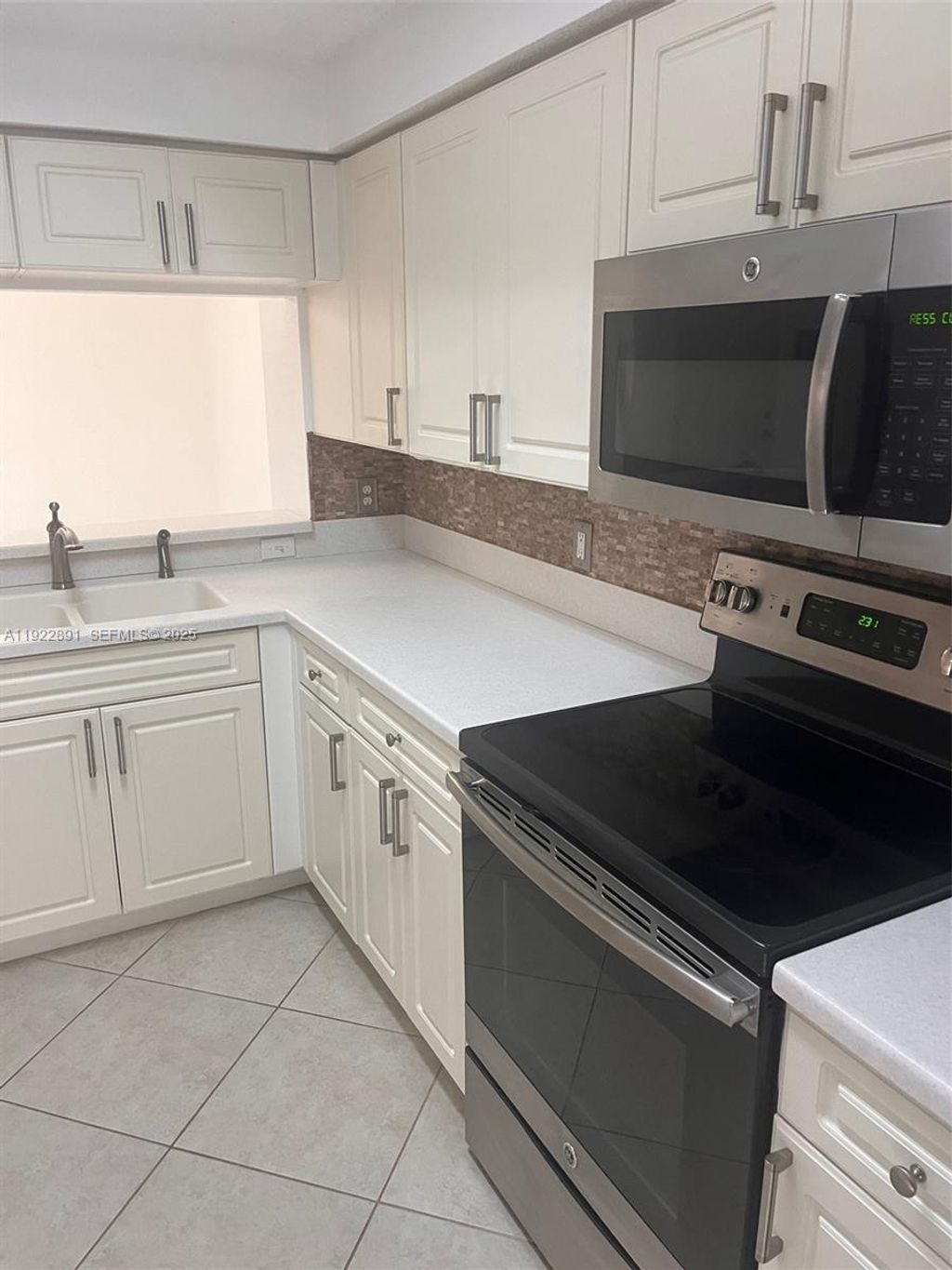 Photo of 3021 Alcazar Pl #203, Palm Beach Gardens, FL 33410 (MLS # A11922891)