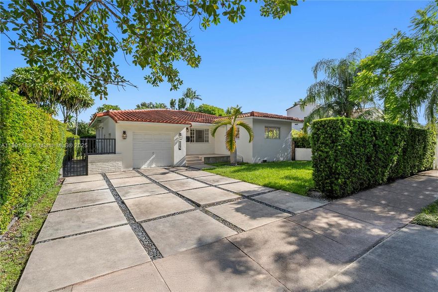 Nestled in the heart of Coral Gables beneath a canopy of majestic banyan trees, this elegant 3BD/2.5BA home offers timeless charm with modern updates. The split floor plan features formal living, dining, and family rooms, plus a one-car garage with storage loft. Recent enhancements include an expanded entryway, tiled front porch, and a two-car concrete driveway. Restored original pinewood and terrazzo floors add character throughout. Ideally located near Salvadore Park, golf, tennis, St. Theresa, Church of the Little Flower, Somerset Academy, and the iconic Biltmore Hotel.