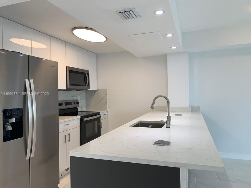 Stunning 5th-floor residence with breathtaking canal and water views, directly across from prestigious Williams Island. This fully remodeled, ultra-modern apartment is filled with natural light and offers abundant storage throughout. New AC unit, New electrical panel and wiring. Full of storage and elegant finishes.  Featuring elegant ceramic tile floors, a beautiful open-concept kitchen designed for both style and functionality, and a spacious bathroom with a large shower, this home is truly move-in ready—perfect to enjoy from day one. Located in a vibrant 55+ community offering an array of amenities and activities, residents enjoy an active and engaging lifestyle. Conveniently situated near hospitals, shopping centers, major highways, and the Brightline train station, and just 10 minutes from the beach. A perfect combination of luxury, comfort, and prime location.