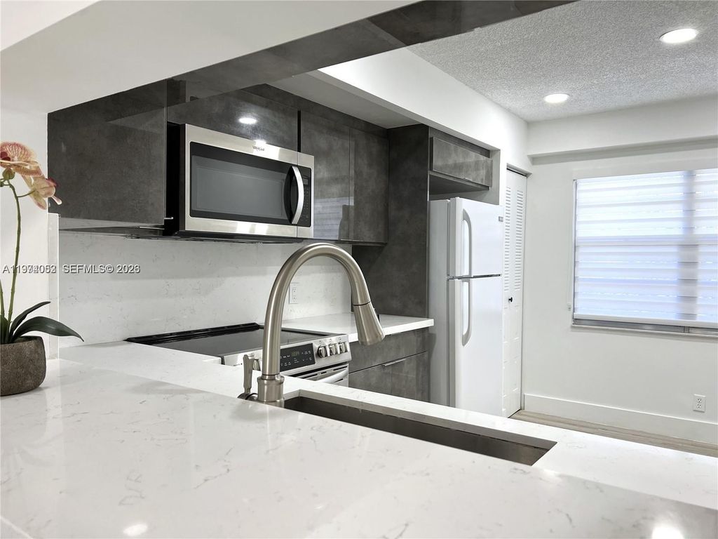 Photo of 1001 SW 128 Ter #406B, Pembroke Pines, FL 33027 (MLS # A11974053)