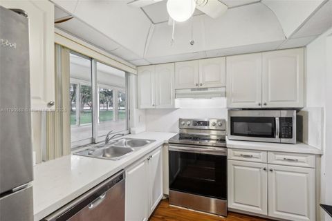 Photo of 9201 Lime Bay Blvd #105, Tamarac, FL 33321 (MLS # A11790552)