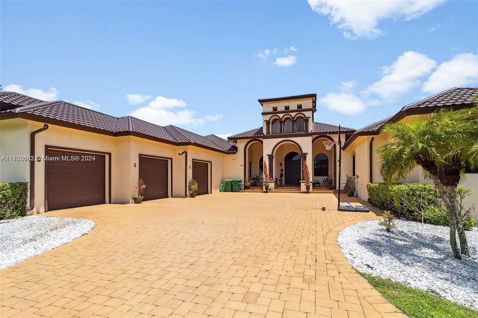 Magnificent custom home with an abundant amount of natural light located in the exclusive Plantation Acres.
Featuring 6 bedrooms, 7 bathrooms, a detached mother-in-law suite, and pool house. Enjoy high ceilings, a renovated chef's kitchen with new appliances, state-of-the-art security, and a surround sound system in both the family room and pool house. 5,500 sq. ft. of air-conditioned space. Newly completed metal roof in 2024 (30 year guarantee until 2054) and a resort-style patio and pool area. Prime location, just minutes from I-595 and I-75.