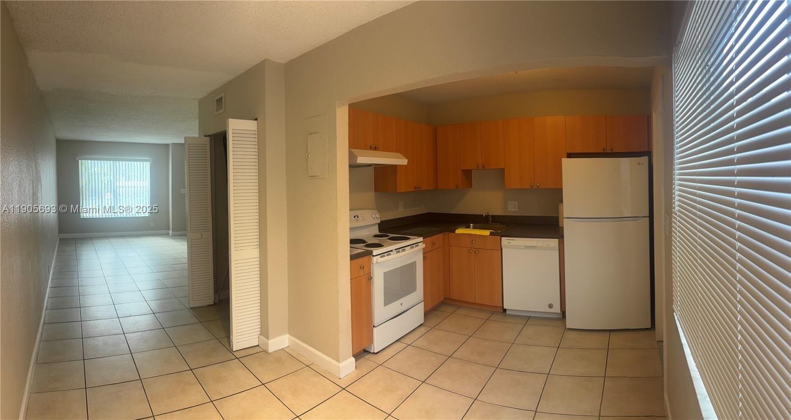 Great Corner Townhouse in the Heart of Plantation "The Townhouses of Plantation." The floor plan offers 2 bedrooms upstair. Tiled in the living areas and wood flooring in bedrooms. Stackable washer and dryer machine. The community offers a pool, tennis court, and playground area. Call me today! Attention !!! We recently painted all unit. Large rooms with plenty closet space. Half bath downstairs. Nice size fenced yard ready to be gardened. Washer, Dryer and Refrigerator will be replaced.