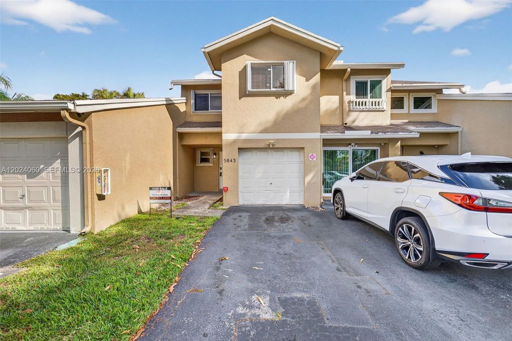 Photo of 5843 Woodlands Blvd #5843, Tamarac, FL 33319 (MLS # A12024060)