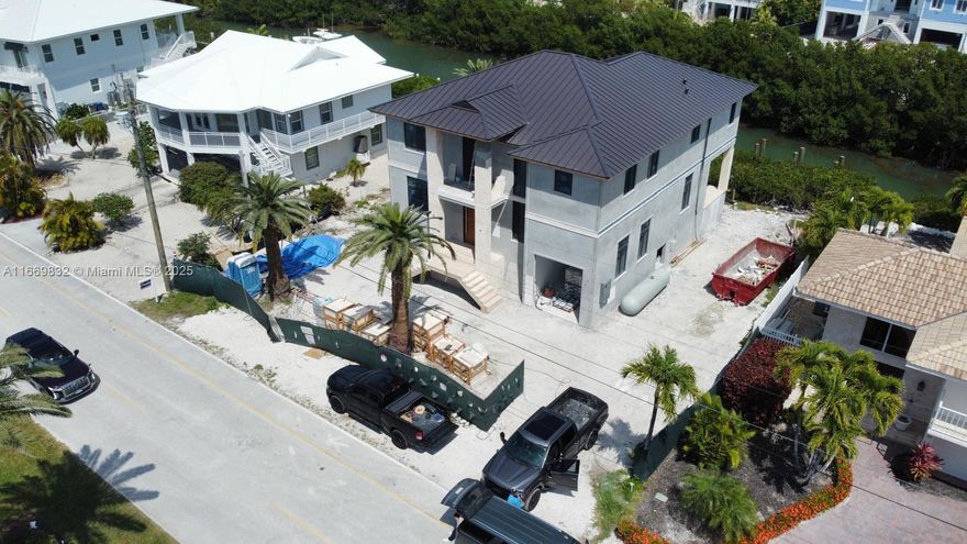 Discover luxury in this stunning waterfront residence with high-end finishes and concrete block construction for elegance and durability.

Enjoy high ceilings, Italian-crafted cabinets, and walk-in closets, complemented by travertine flooring and natural wood in the bedrooms. Property features a circle driveway, single-car garage, and expansive covered terrace, perfect for entertaining.

Relax by the modern pool (10x28 ft, 5 ft deep) with a wraparound bench and shallow area for children—ideal for gatherings. Highlights include a propane stove,a 70-foot wooden T dock,a walk-in pantry, and an outdoor BBQ area.

Act quickly to choose the final finishes and personalize this spectacular property. Seize this chance to own a luxury home in one of Florida’s most coveted areas! See attached!