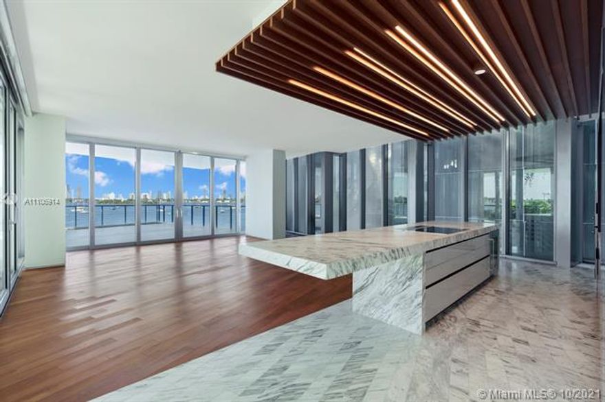 Never been lived masterpiece Only unit with X-large terrace featuring a water feature & private staircase leading from terrace down to pool/jacuzzi. Custom Polyform built out closets. Composed of 59 individually designed waterfront residences around a glittering lagoon Monad Terrace by Pritzker Winner Jean Nouvel, provides brilliant light, private outdoor space, climbing gardens, unique sawtooth honeycomb facades & stunning sunset views of Biscayne Bay. Kitchens with dramatic sculptural marble island in Calacatta. Master baths with richly veined, spacious stone countertops, marquetry flooring & tiled walls. Other notable features include custom cabinetry & built-in features, designer fixtures, teak flooring throughout & private elevators. Walk to the best areas in south beach and the ocean