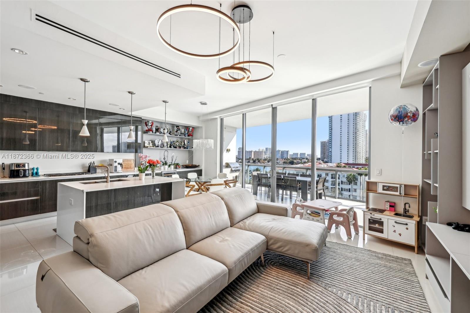TURNKEY, FURNISHED UNIT. Step into the ultimate luxury lifestyle with this exquisite 3-bed, 4.5-bath residence, with a maid’s room and private elevator access. Spent more than $200k in upgrades. It features an open floor plan with premium finishes, including Wolf & Subzero appliances, custom Italian cabinetry, and sleek stone countertops. Floor-to-ceiling windows offer breathtaking, unobstructed water views from every room, and seamless ceramic flooring. The expansive balcony, complete with a built-in grill, is perfect for al fresco dining and sunset views. Luxurious marble bathrooms, soaring 10’ ceilings, and integrated Apple Home Technology elevate your living experience. Enjoy 5-star amenities. SELLER MOTIVATED.