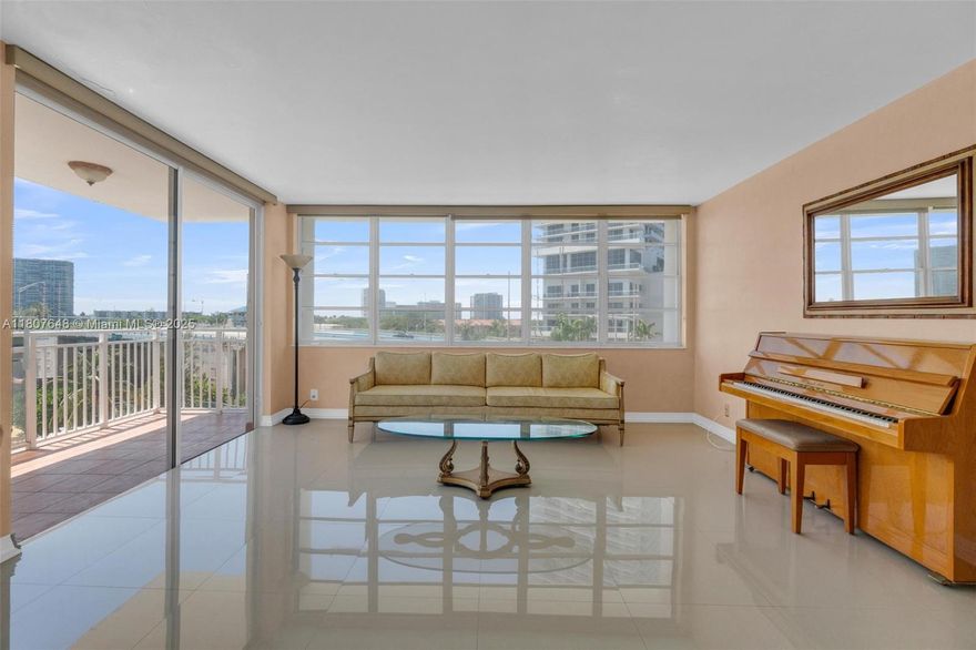 Imagine waking up to stunning WATERFRONT intracoastal  views and strolling across the street to a GORGEOUS BEACH with swaying palm trees and turquoise waters.  At Imperial Towers North, that dream can be yours everyday.  This spacious condo has been BEAUTIFULLY REMODELED with quality finishes and thoughtful design.  GLEAMING 36 inch porcelain tile floors flow throughout, perfectly complimenting granite countertops and an inviting open kitchen featuring a bright window W/ WATER VIEWS, a breakfast bar, tons of cabinetry w/full extension pull out drawers and massive storage. Expansive walls of glass bring in loads of light all day and offer gorgeous, sparkling views from morning to night.
