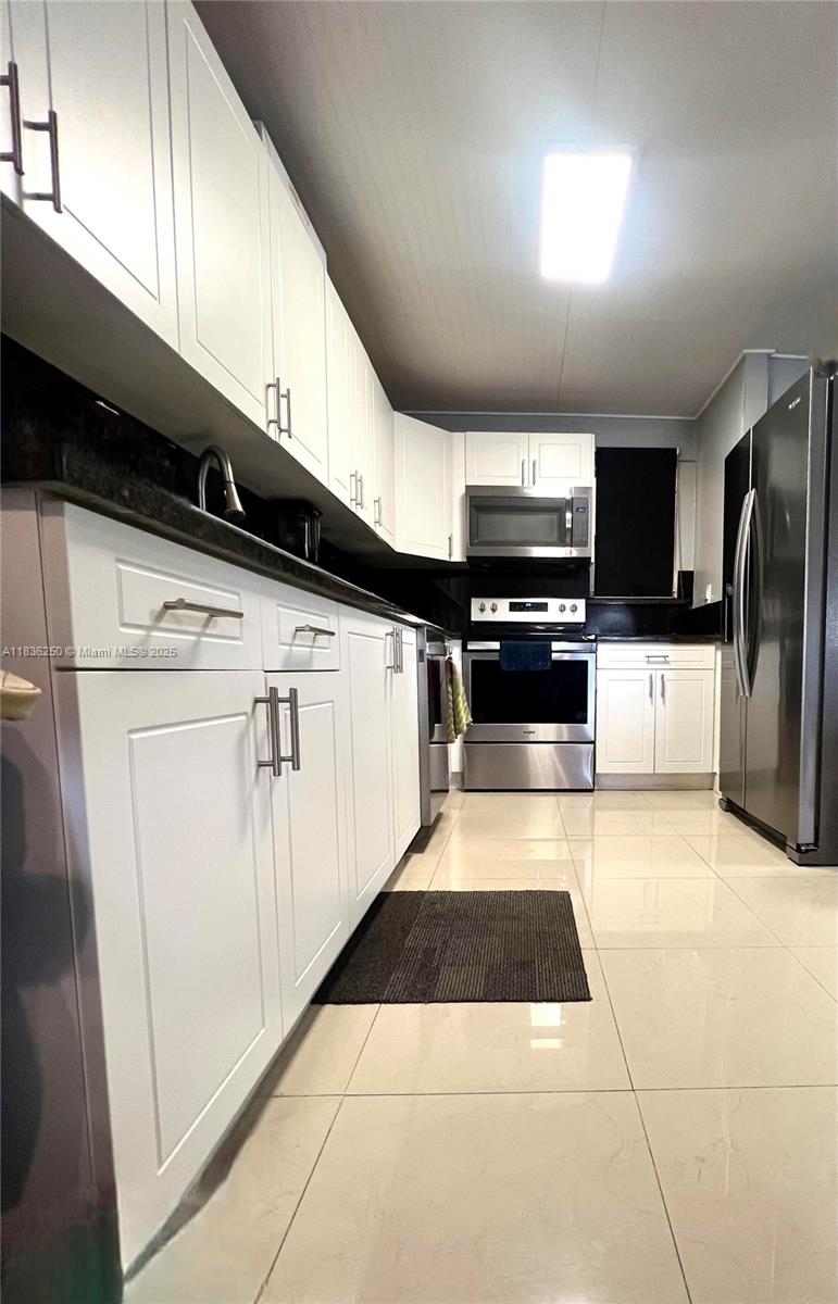 SELLER MOTIVATED to sale and would like to hear your best offer. 50 year certification completed. Stunning 3-bed, 2-bath Condo in prime central location, only 2 min to Palmeto Expwy. Don't miss this incredible opportunity to own this spacious 1309 sq ft and well maintained condo in the heart of Miami. Located at Palm East Condominiums, This bright unit offers a comfortable layout ideal for families or investors. This easy to show home features, impact doors and windows, ceramic floors, washer and dryer in unit and 2 separate entrances offering private privacy, perfect for older children, guests, or convert to a home office setup. Secure gated complex with full amenities that include tennis courts, clubroom, laundry facilities, and swimming pool.