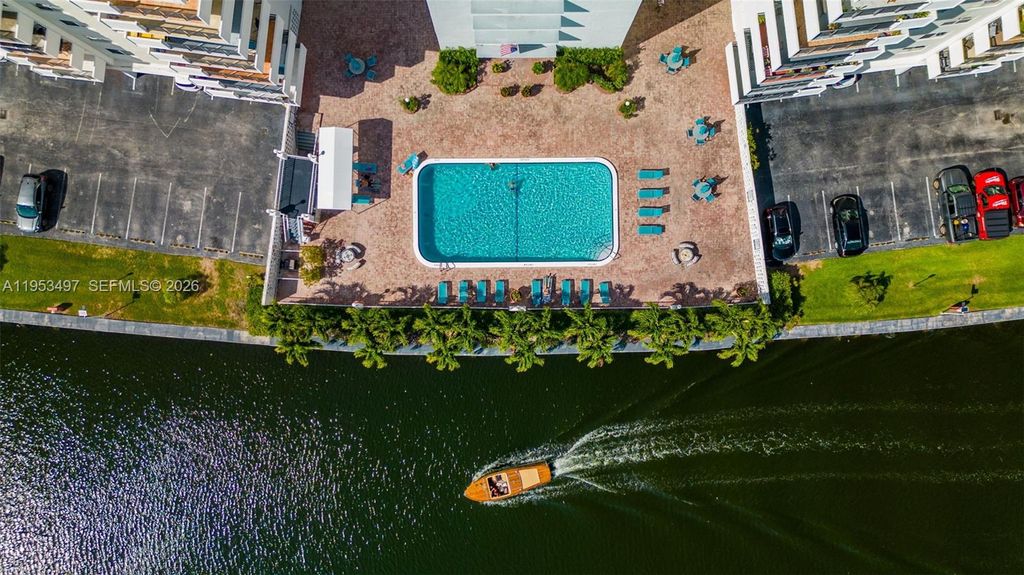 Photo of 401 Golden Isles Dr #304, Hallandale Beach, FL 33009 (MLS # A11953497)