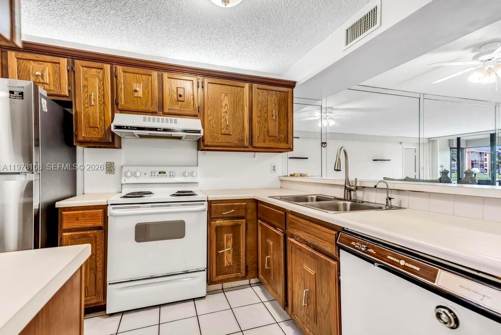 Photo of 5802 Coral Lake Dr #102, Margate, FL 33063 (MLS # A11978108)